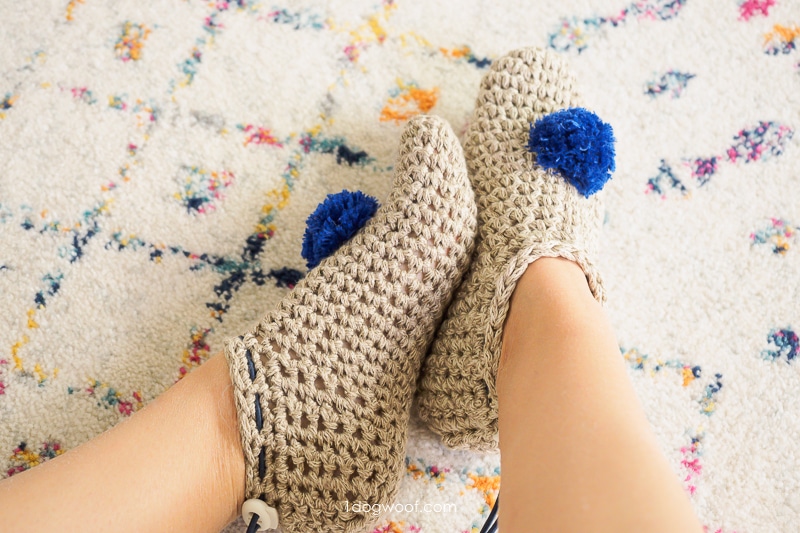 hand made crochet slippers with blue pompoms